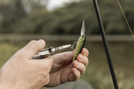 person-fixing-fish-hook